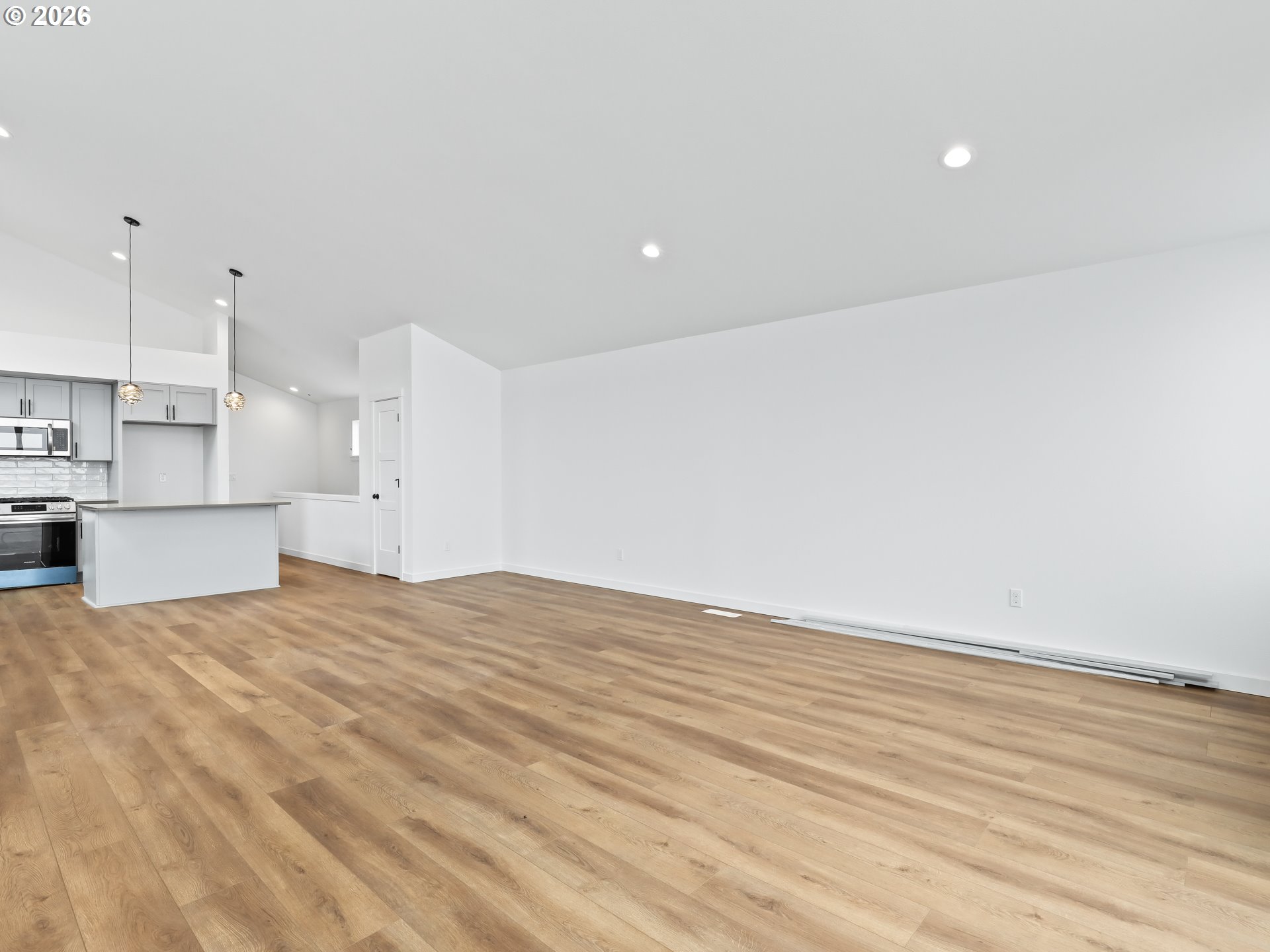 41870 Deschutes Avenue, Unit 11 Sandy, OR 97055 - Photo 15 of 43 a view of kitchen with refrigerator and wooden floor