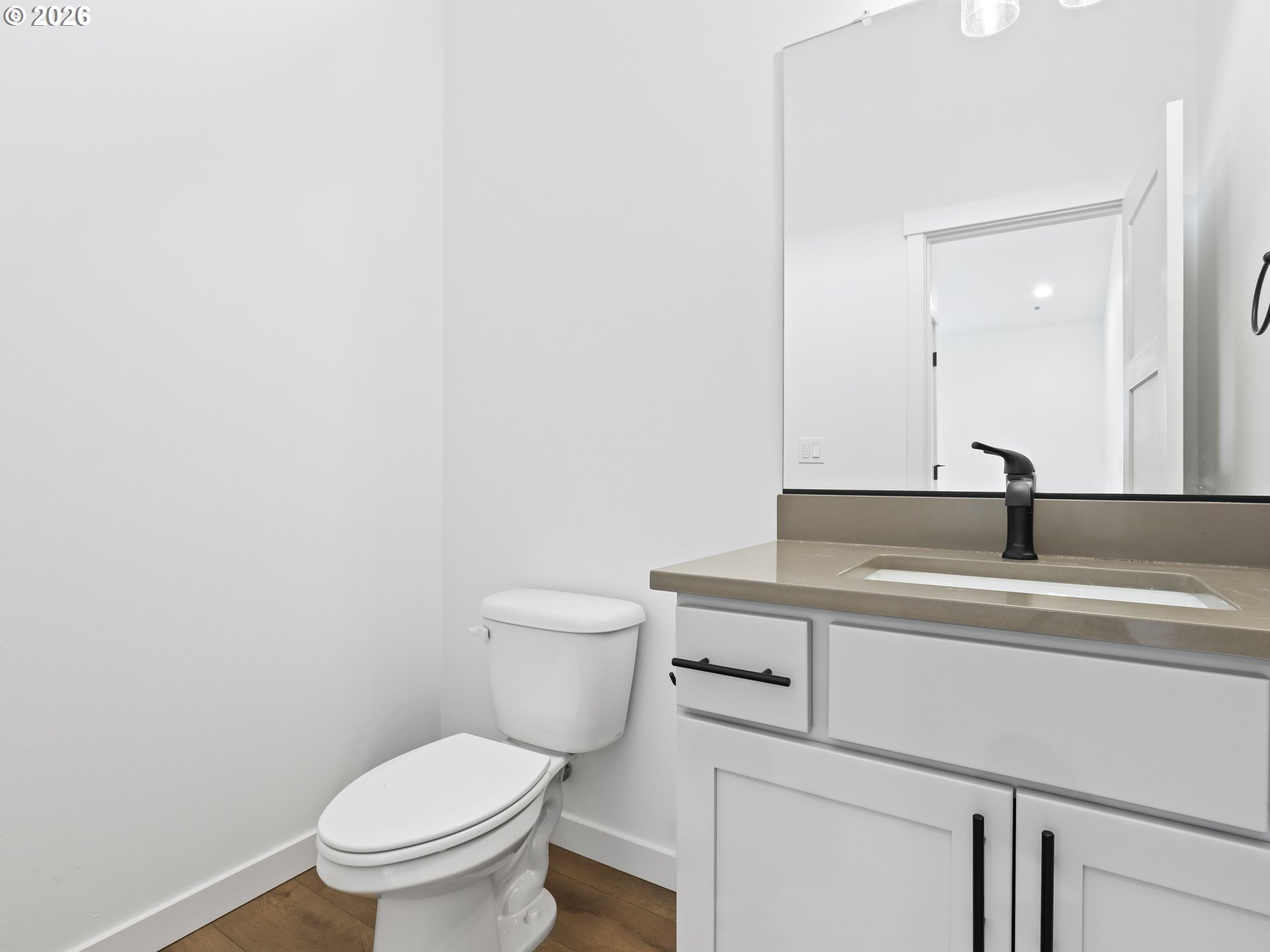41870 Deschutes Avenue, Unit 11 Sandy, OR 97055 - Photo 17 of 43 a bathroom with a toilet a sink and mirror