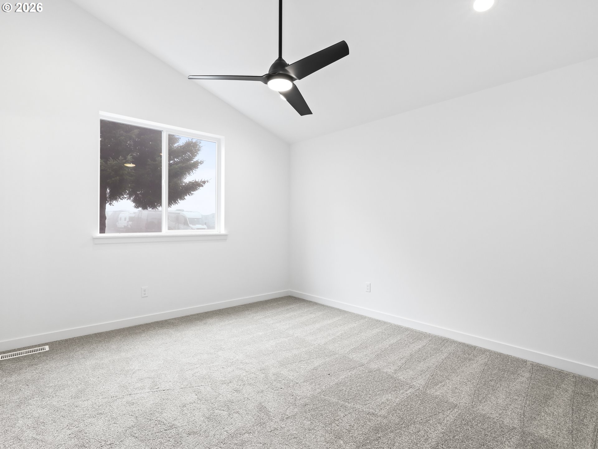 41870 Deschutes Avenue, Unit 11 Sandy, OR 97055 - Photo 18 of 43 an empty room with a window and a ceiling fan