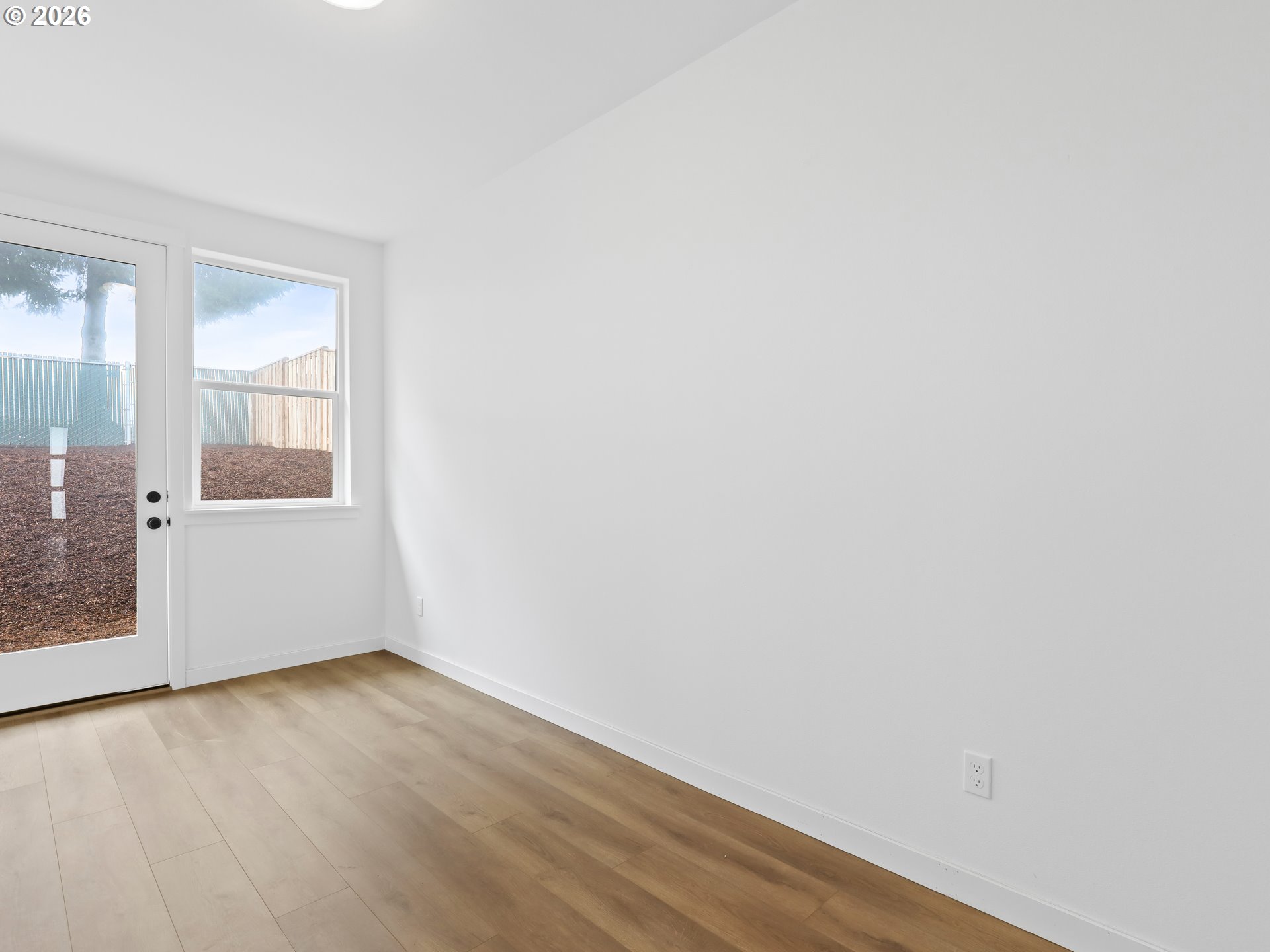 41870 Deschutes Avenue, Unit 11 Sandy, OR 97055 - Photo 26 of 43 an empty room with wooden floor and windows