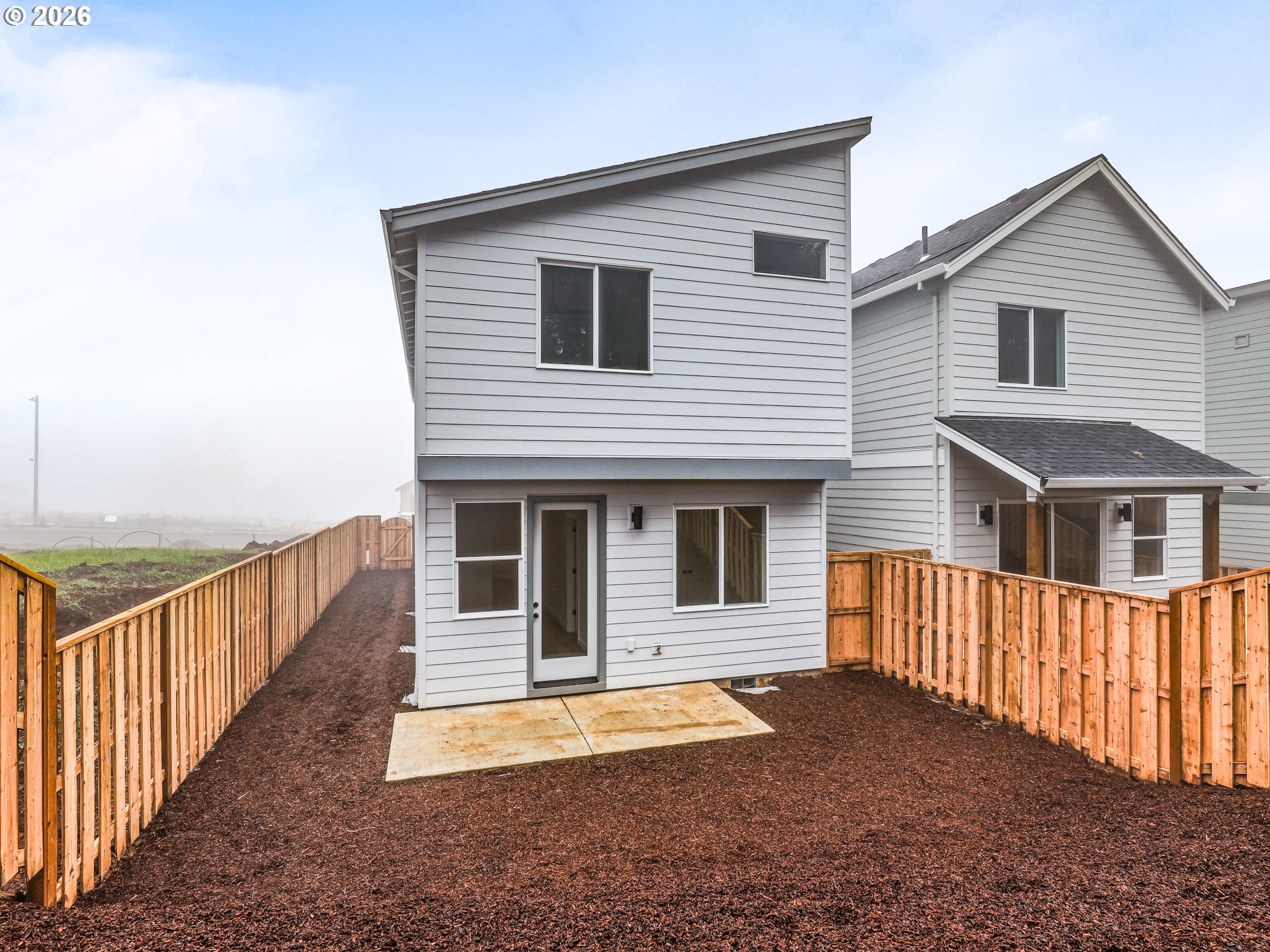 41870 Deschutes Avenue, Unit 11 Sandy, OR 97055 - Photo 40 of 43 a front view of a house with wooden fence