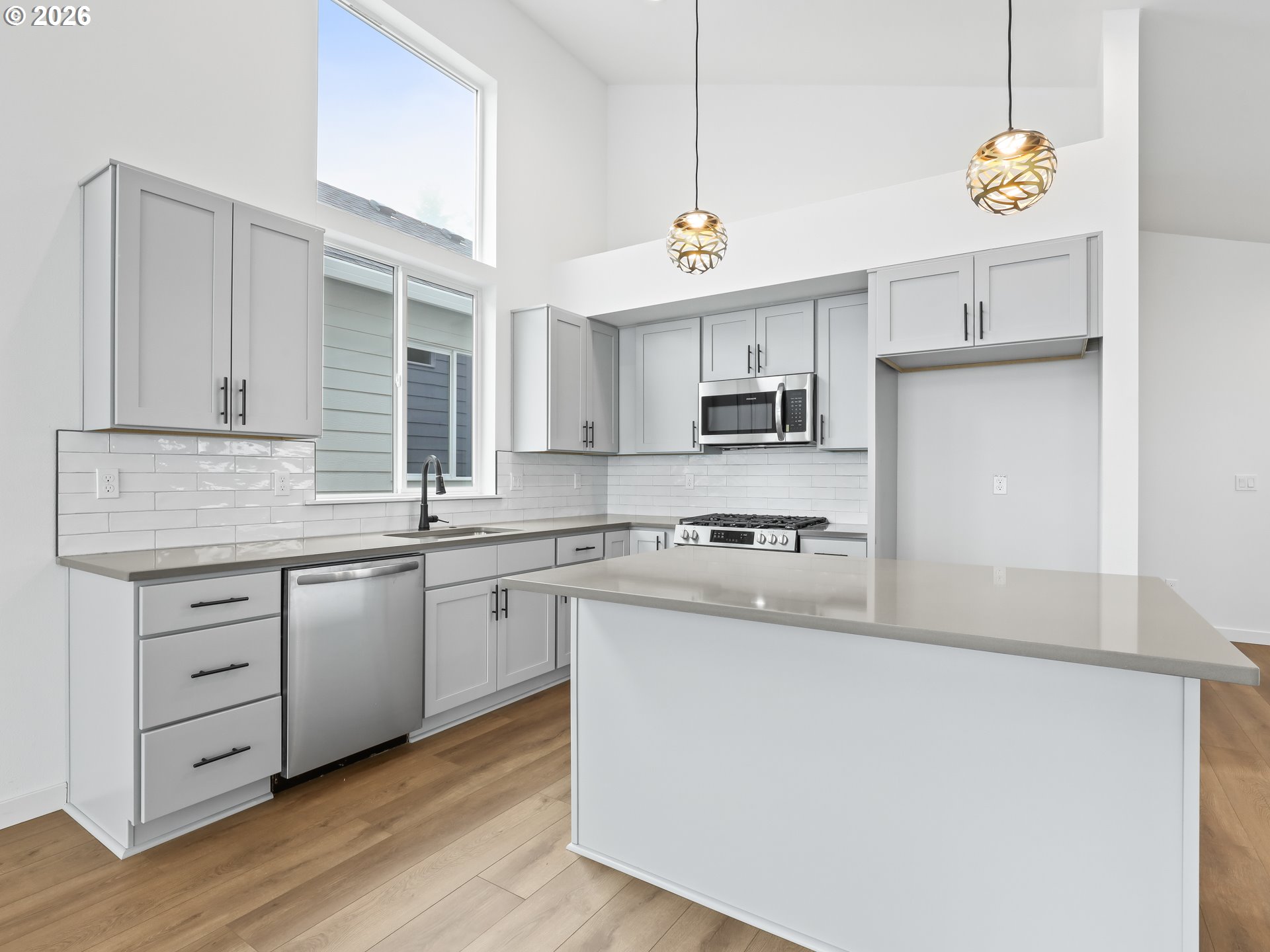 41870 Deschutes Avenue, Unit 11 Sandy, OR 97055 - Photo 4 of 43 a kitchen with stainless steel appliances granite countertop a sink a stove and a refrigerator