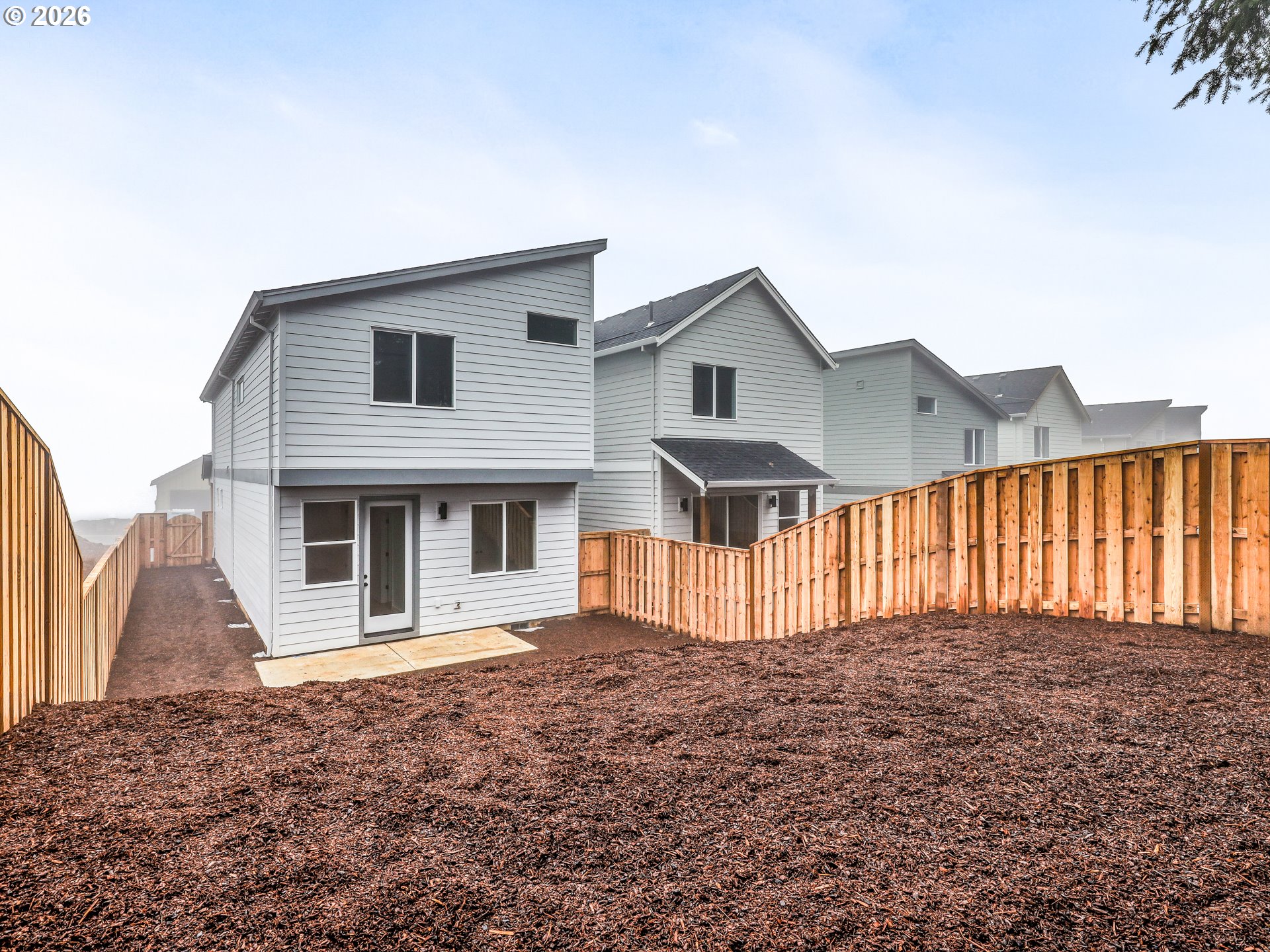 41870 Deschutes Avenue, Unit 11 Sandy, OR 97055 - Photo 41 of 43 a front view of a house with large windows