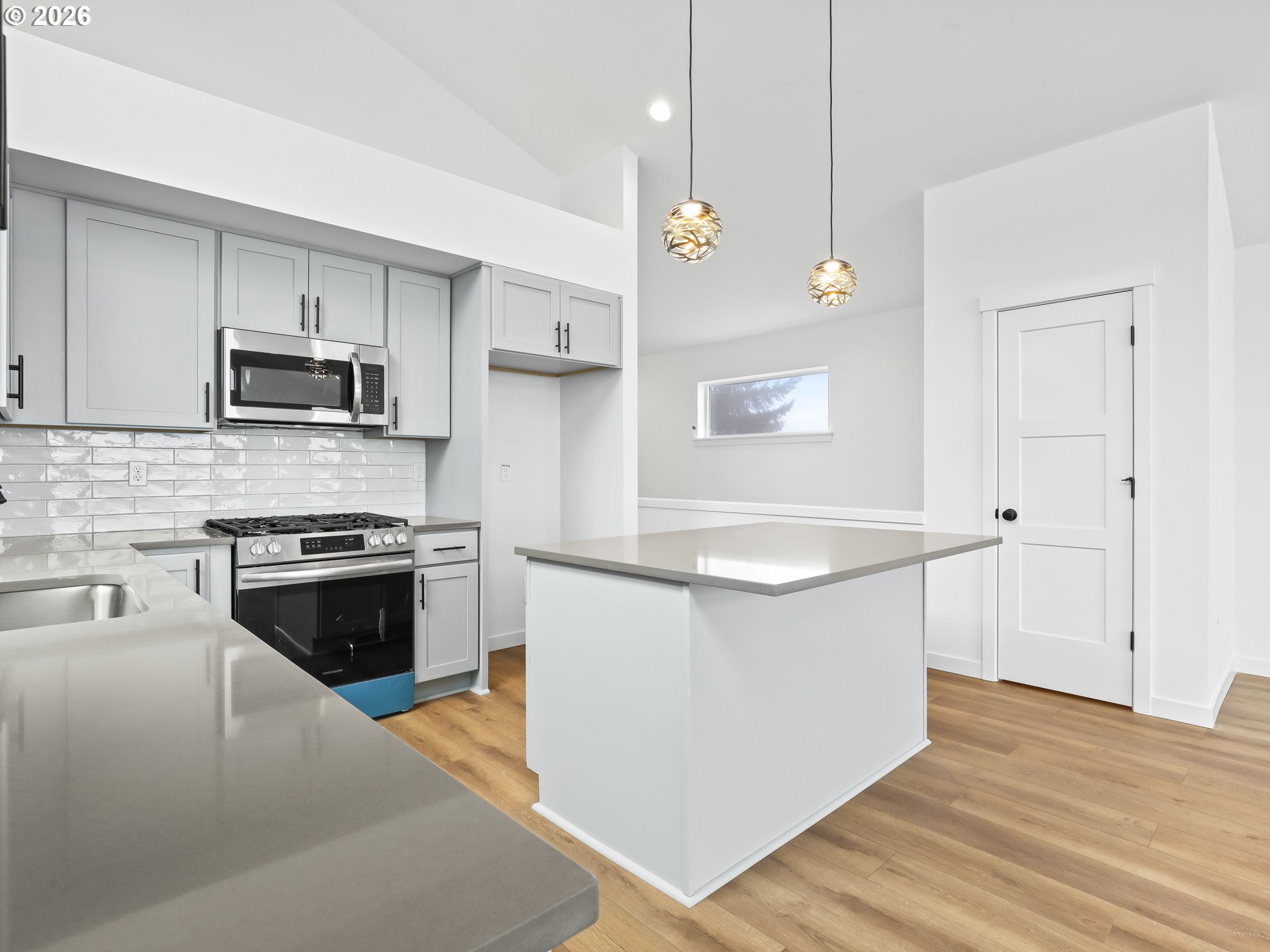 41870 Deschutes Avenue, Unit 11 Sandy, OR 97055 - Photo 6 of 43 a kitchen with granite countertop a sink and a stove top oven