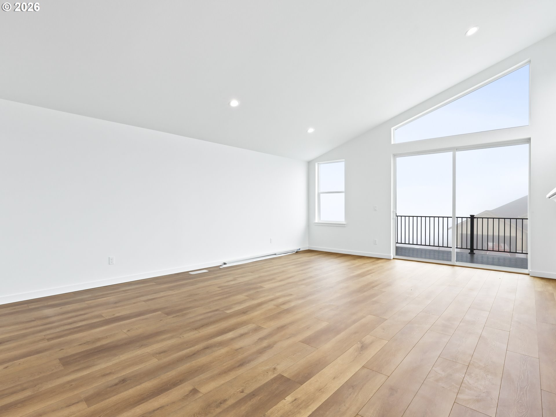 41870 Deschutes Avenue, Unit 11 Sandy, OR 97055 - Photo 8 of 43 an empty room with wooden floor and windows