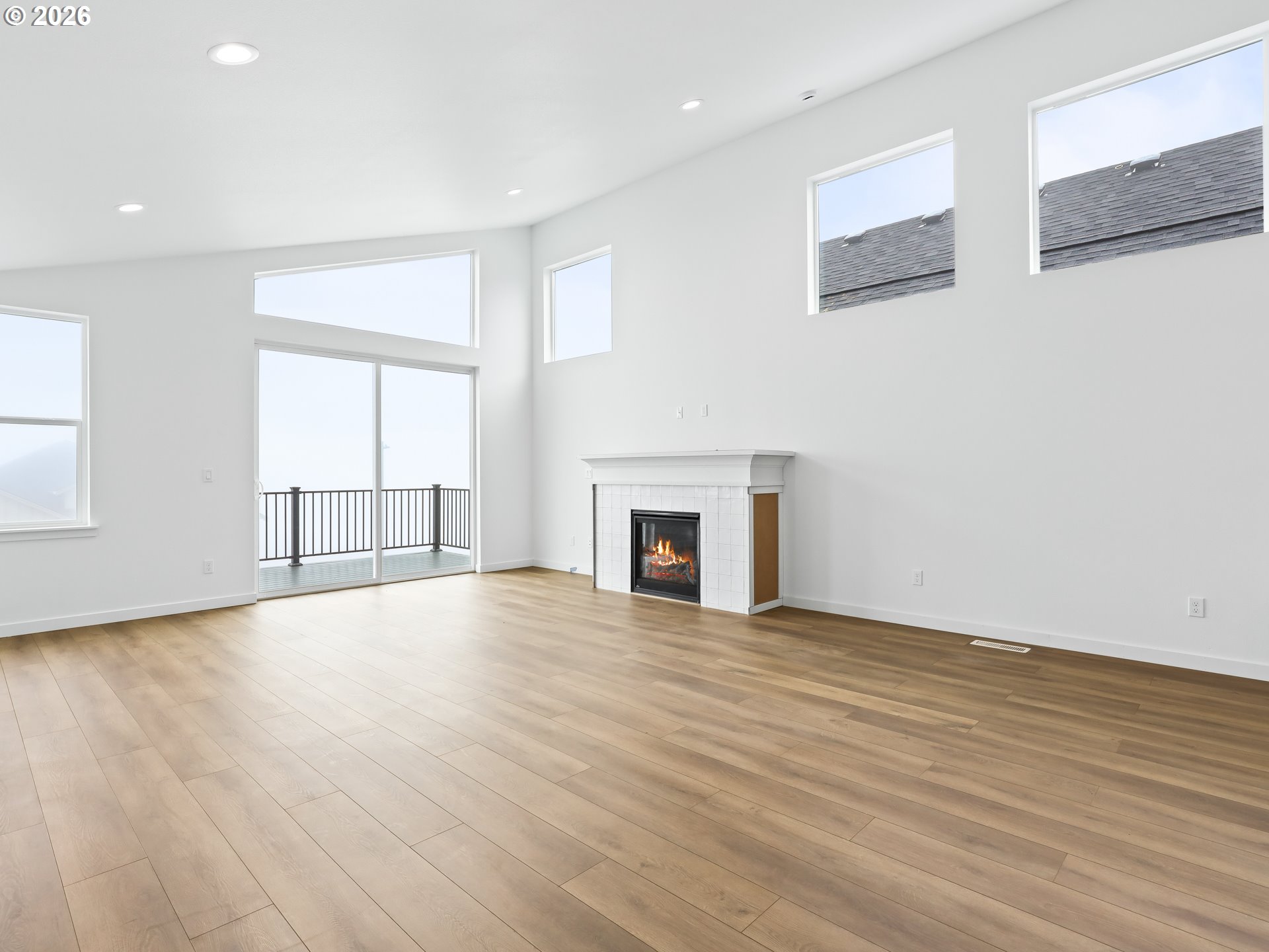 41870 Deschutes Avenue, Unit 11 Sandy, OR 97055 - Photo 10 of 43 a view of an empty room with wooden floor and a window