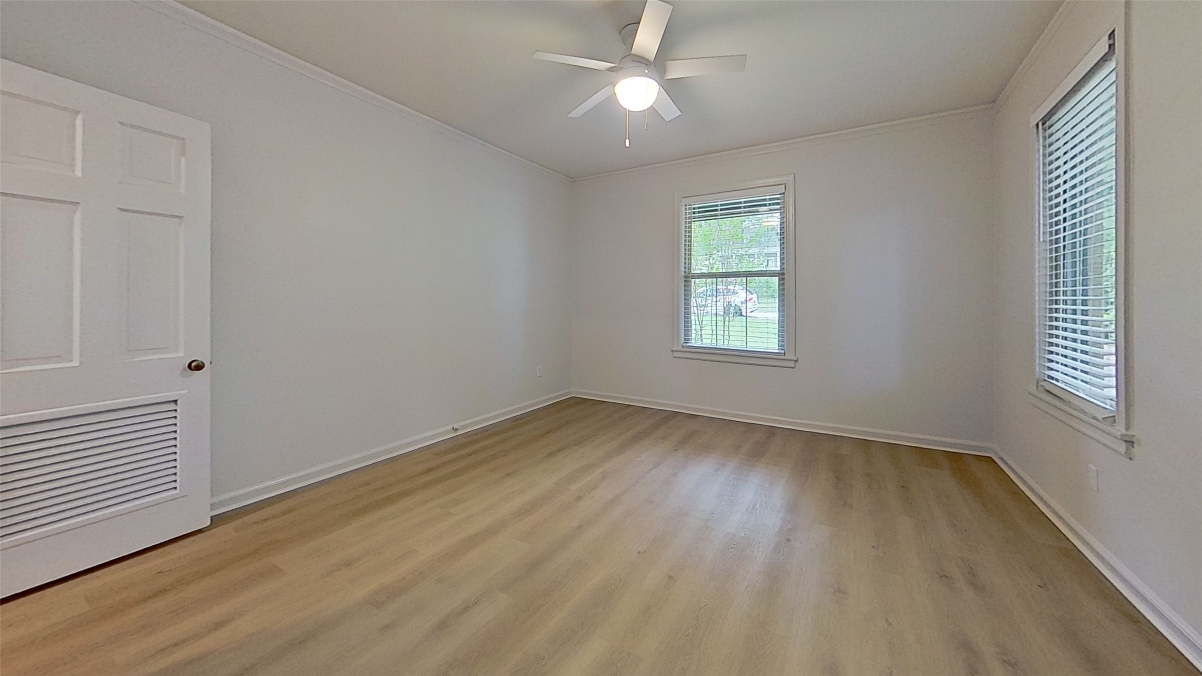 1703 Summit View Place, Unit A Austin, TX 78703 - Photo 10 of 13 Laminate flooring and a ceiling fan create a comfortable and modern ambiance in this inviting room.