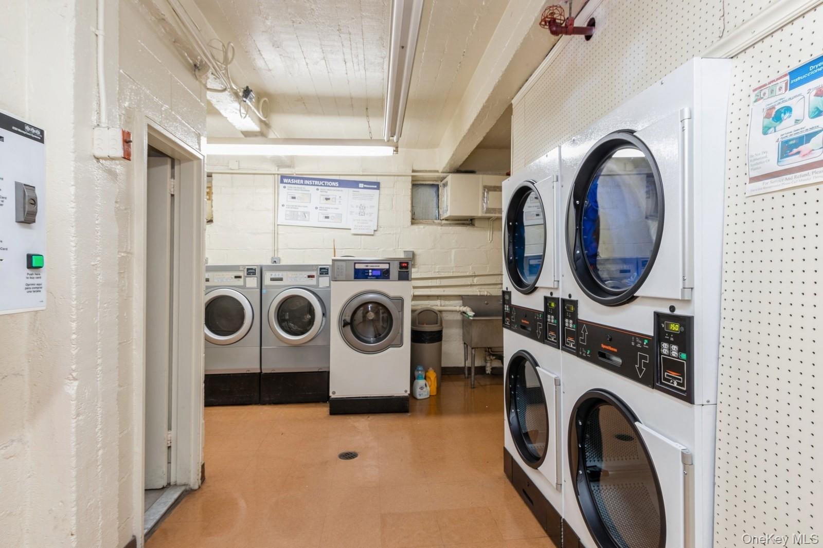 99-10 60th Avenue, Unit 6EE Queens, NY 11368 - Photo 13 of 14 Shared laundry room featuring stacked washer / dryer