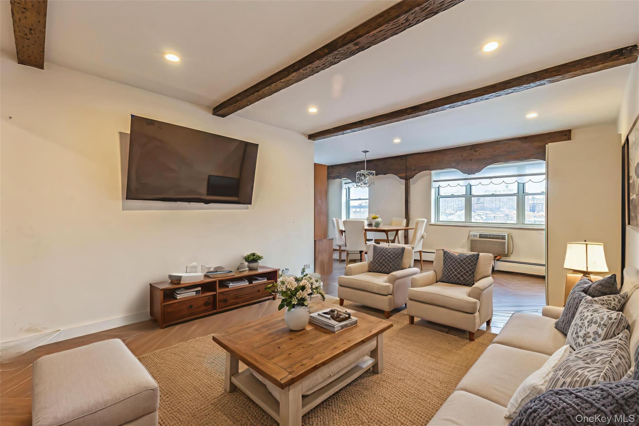 99-10 60th Avenue, Unit 6EE Queens, NY 11368 - Photo 2 of 14 Living room featuring ceiling, recessed lighting, wood finished floors, a baseboard radiator, and a wall mounted air conditioner