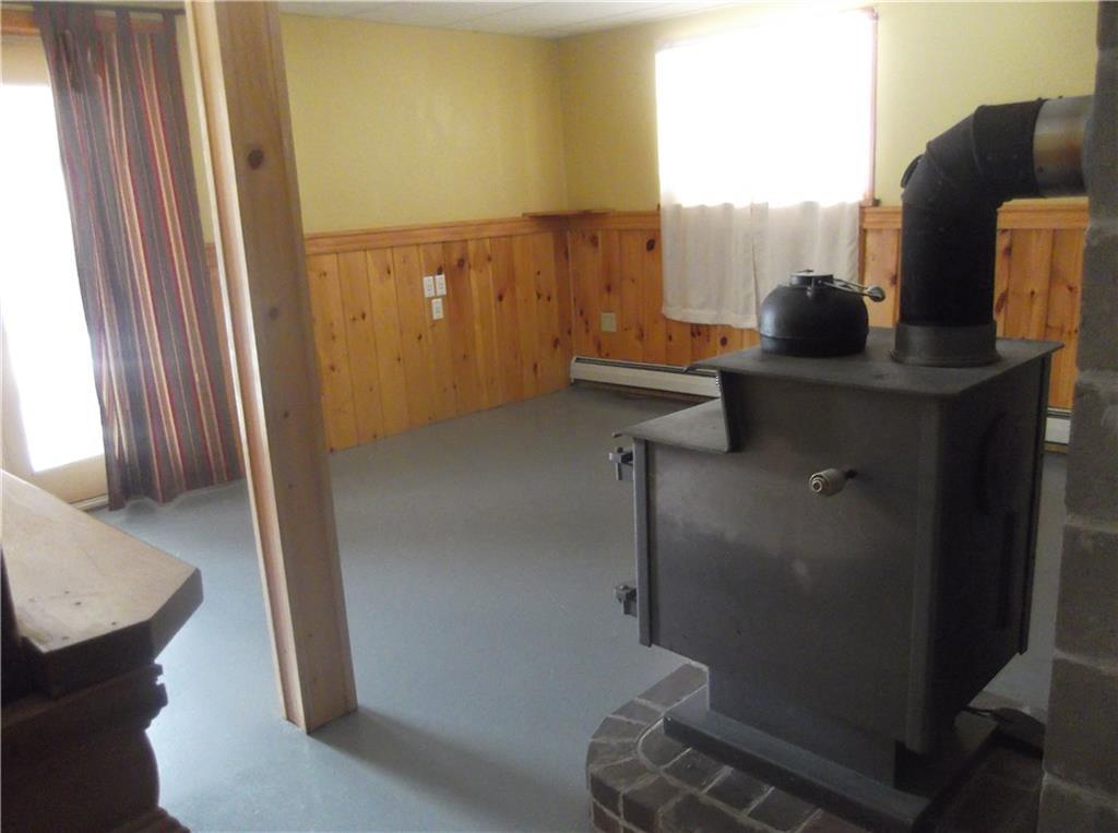 21 Tuttle Road Cornville, ME 04976 - Photo 20 of 35 Family room with wood stove