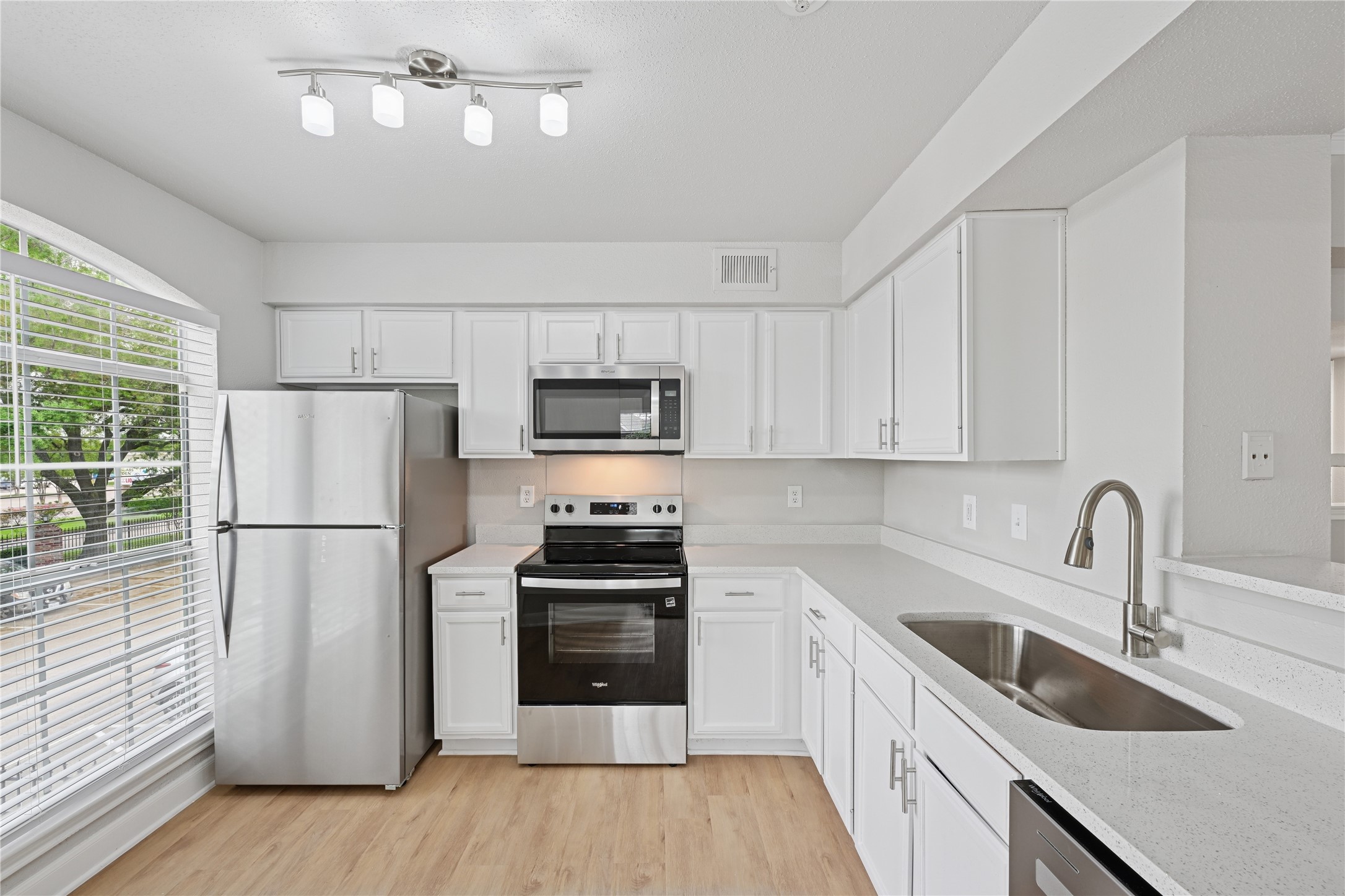 10990 West Road, Unit 808 Houston, TX 77064 - Photo 14 of 19 a kitchen with stainless steel appliances a refrigerator sink and cabinets