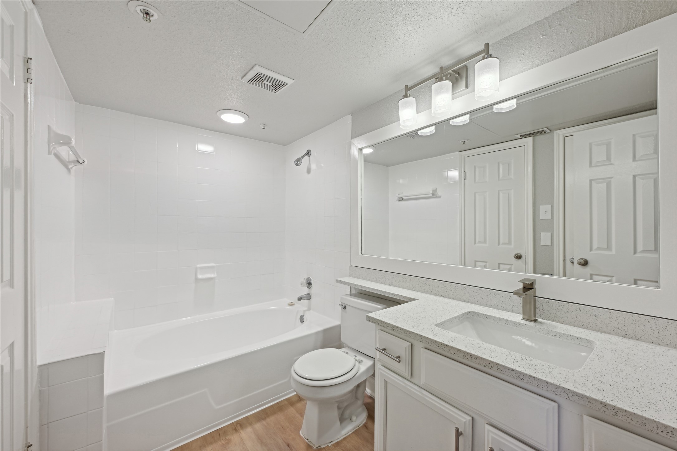 10990 West Road, Unit 808 Houston, TX 77064 - Photo 19 of 19 a bathroom with a sink a toilet a mirror and shower