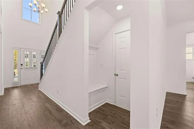 a kitchen with appliances a sink and cabinets