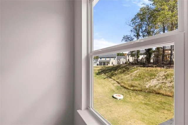 a view of a hallway with entryway door