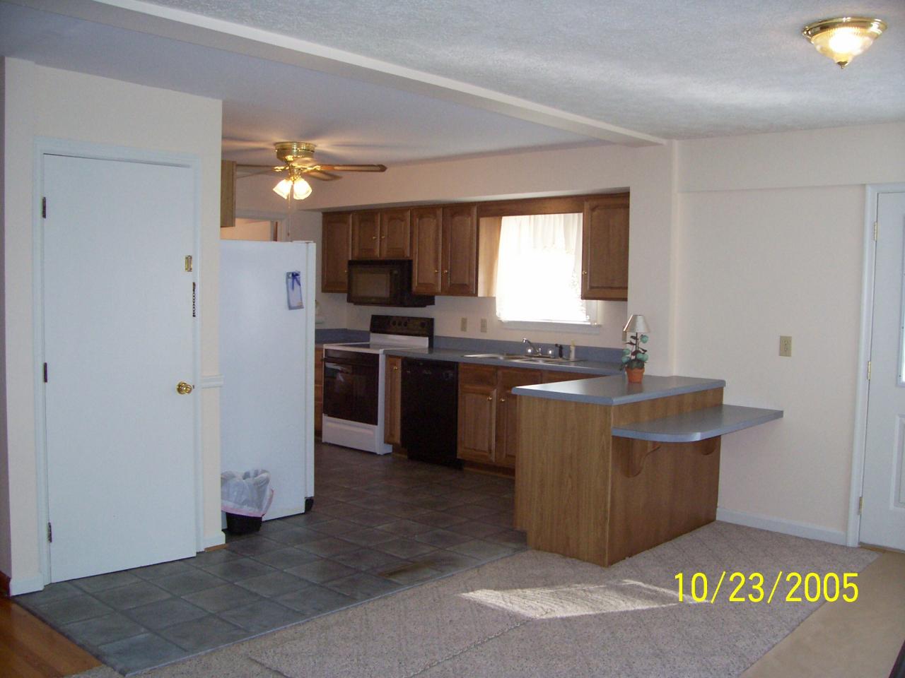 528 Olney Road Vinton, VA 24179 - Photo 3 of 13 a kitchen with stainless steel appliances granite countertop a stove a sink and a refrigerator