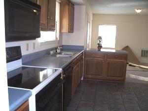 528 Olney Road Vinton, VA 24179 - Photo 5 of 13 a kitchen with stainless steel appliances granite countertop a sink a stove and a microwave
