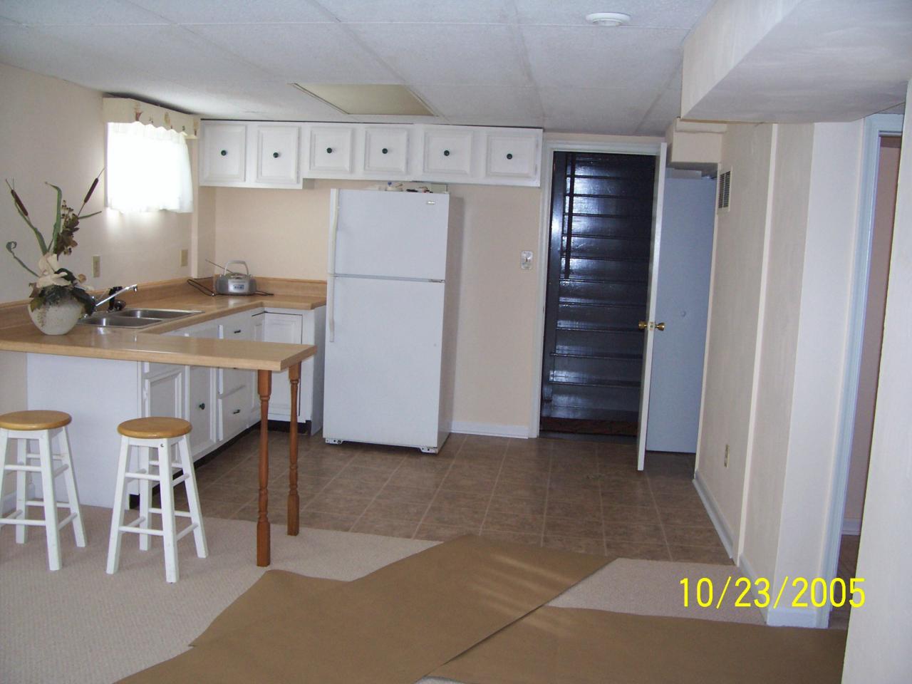 528 Olney Road Vinton, VA 24179 - Photo 10 of 13 a kitchen with a refrigerator a table and chairs
