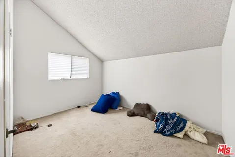 a room with a bed and a window