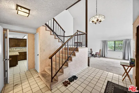 a view of an entryway and livingroom