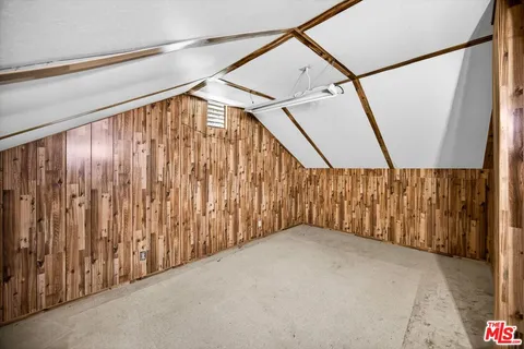 a view of wooden house with an ocean