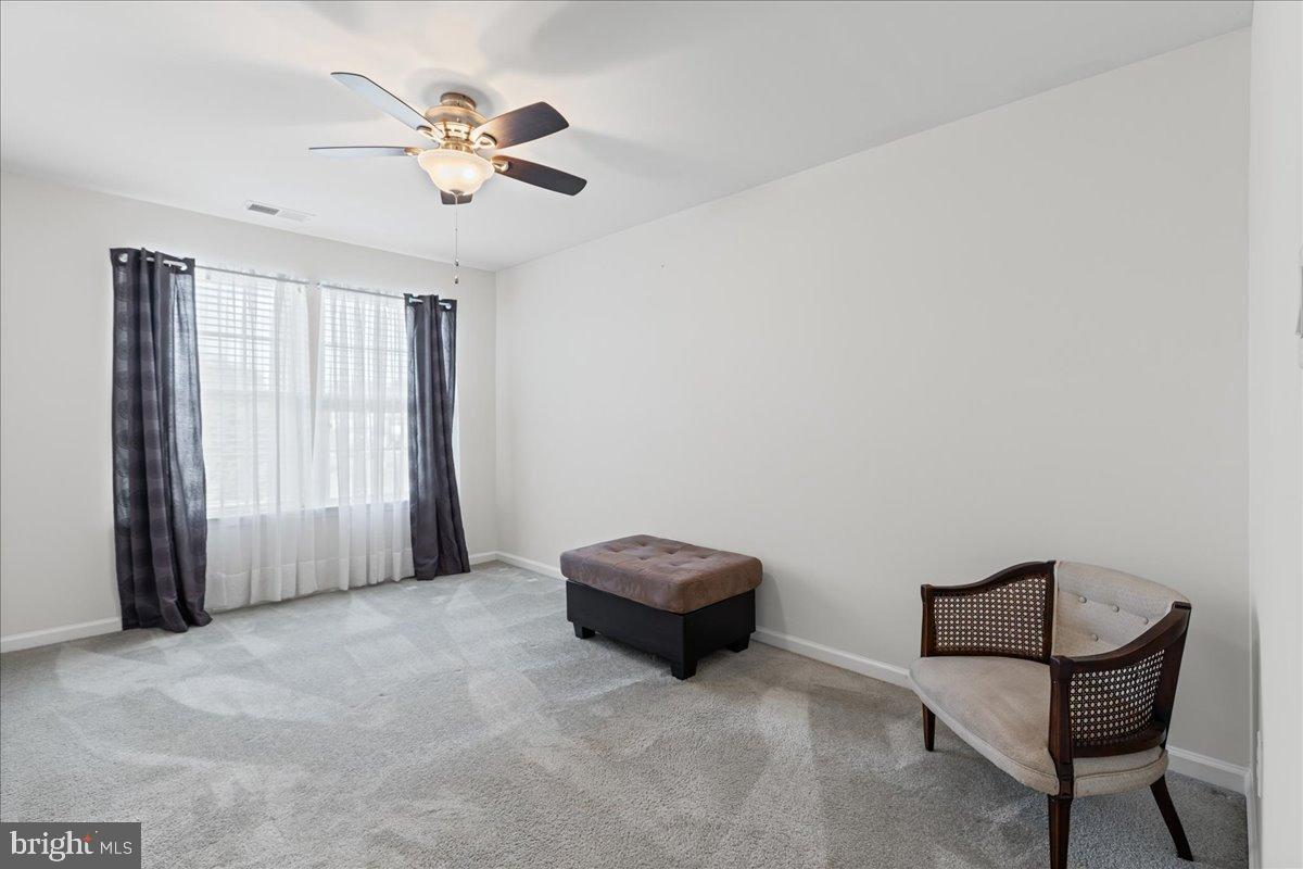 54 Heals Farm Road Burlington, NJ 08016 - Photo 19 of 26 a living room with furniture and a ceiling fan