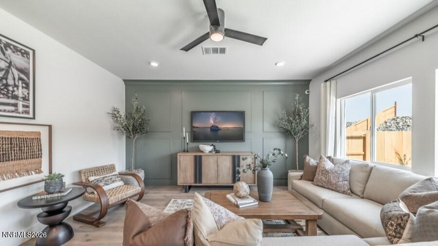 494 Daisy Fay Way Carson City, NV 89705 - Photo 12 of 28 a living room with furniture and a flat screen tv