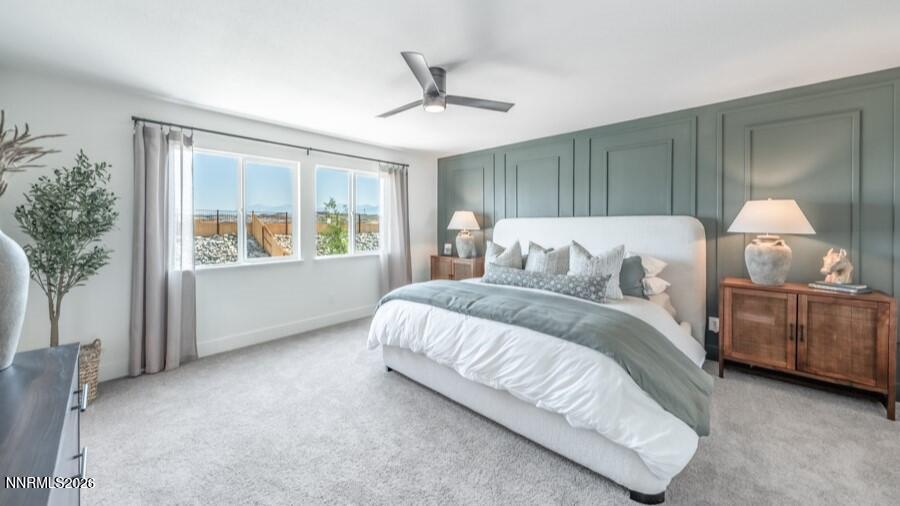 494 Daisy Fay Way Carson City, NV 89705 - Photo 17 of 28 a bed sitting in a spacious bedroom next to a window