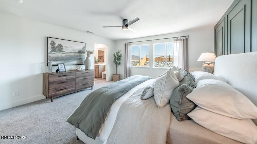 494 Daisy Fay Way Carson City, NV 89705 - Photo 18 of 28 a spacious bedroom with a bed and window