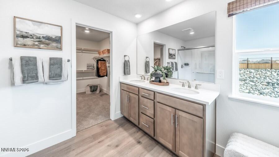 494 Daisy Fay Way Carson City, NV 89705 - Photo 19 of 28 a spacious bathroom with a double vanity sink and a mirror