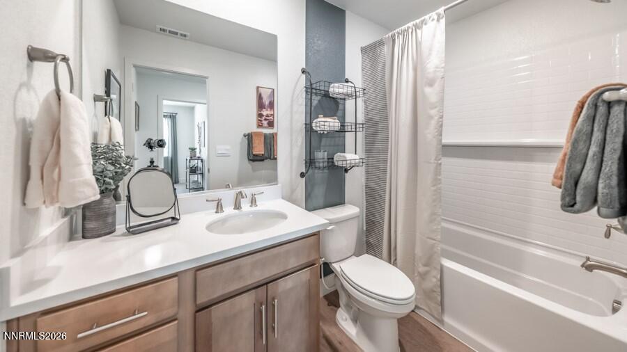 494 Daisy Fay Way Carson City, NV 89705 - Photo 27 of 28 a bathroom with a granite countertop sink toilet and shower