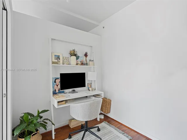 a view of a workspace with furniture