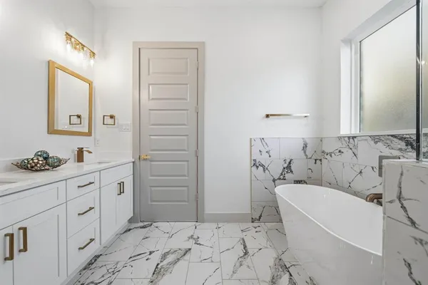 a bathroom with a sink toilet and vanity