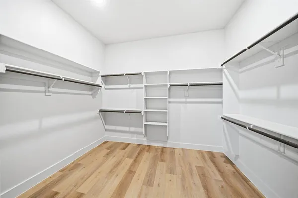 a view of an empty walk in closet