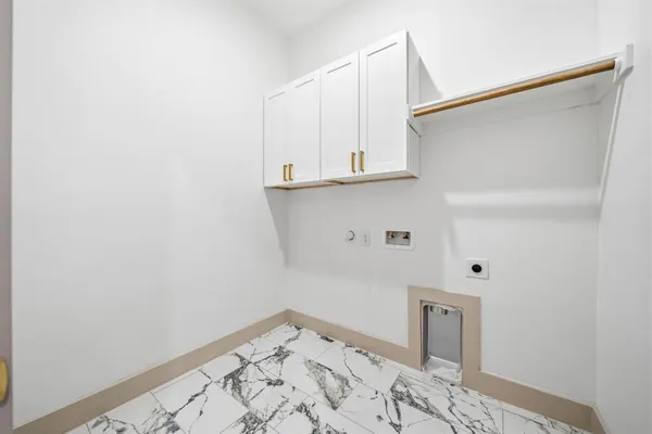 a view of storage and utility room with wooden floor