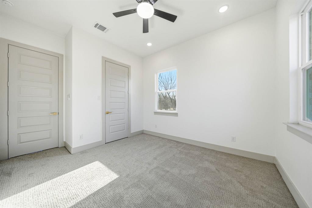 39290 Cedar Trail Whitney, TX 76692 - Photo 31 of 40 an empty room with a ceiling fan and a window