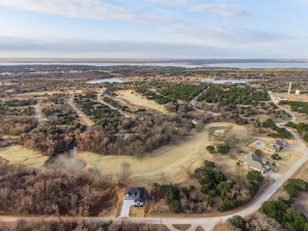 an aerial view of residential building and lake