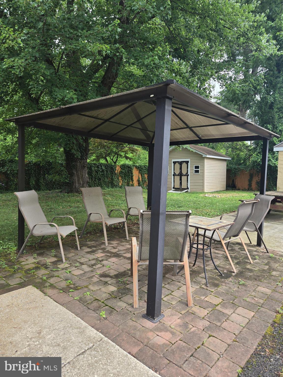 1492 Faulkland Road Wilmington, DE 19805 - Photo 21 of 23 a view of a patio with a table chairs and a backyard