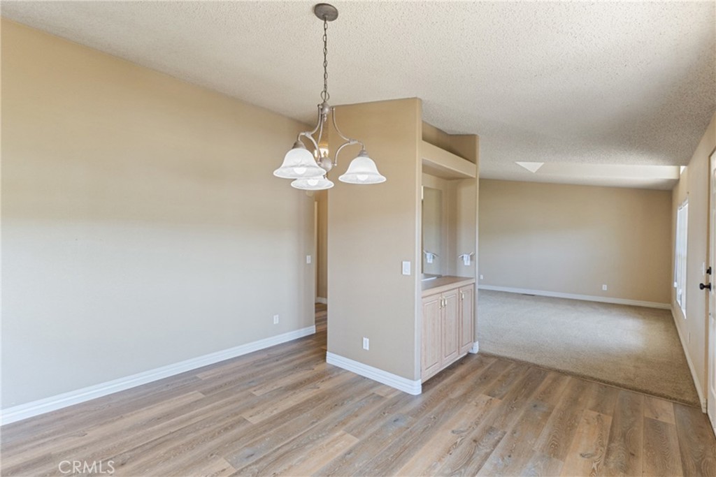 33105 Santiago Road, Unit 149 Acton, CA 93510 - Photo 15 of 28 a view of a chandelier in a room with a window