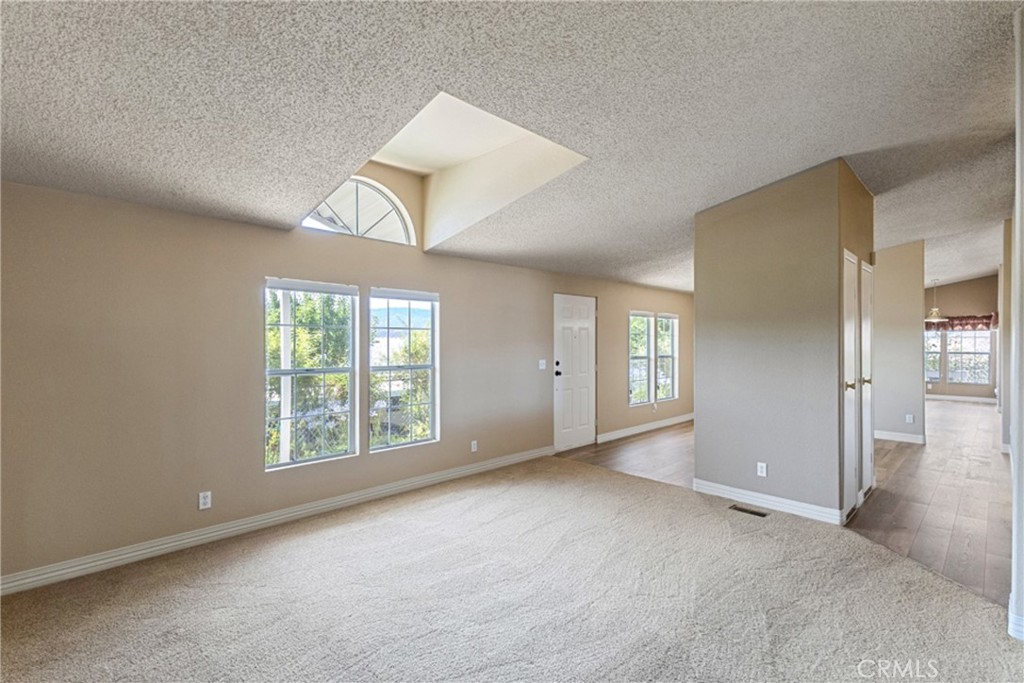 33105 Santiago Road, Unit 149 Acton, CA 93510 - Photo 17 of 28 an empty room with windows and closet