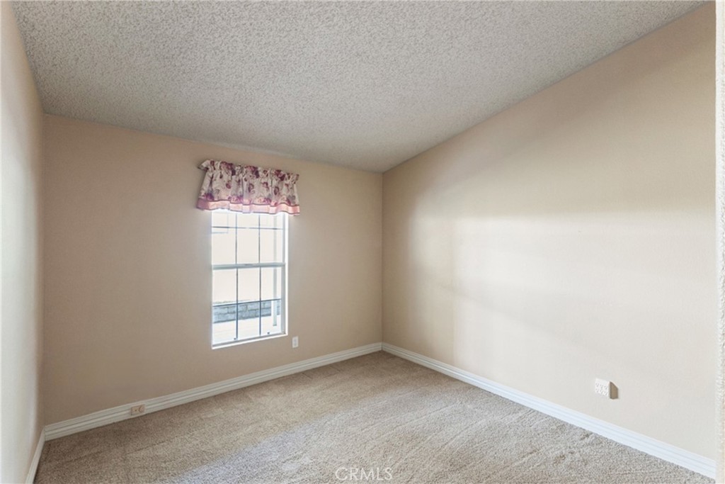 33105 Santiago Road, Unit 149 Acton, CA 93510 - Photo 19 of 28 an empty room with a window