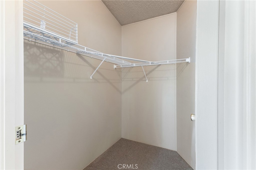 33105 Santiago Road, Unit 149 Acton, CA 93510 - Photo 23 of 28 a view of an empty walk in closet