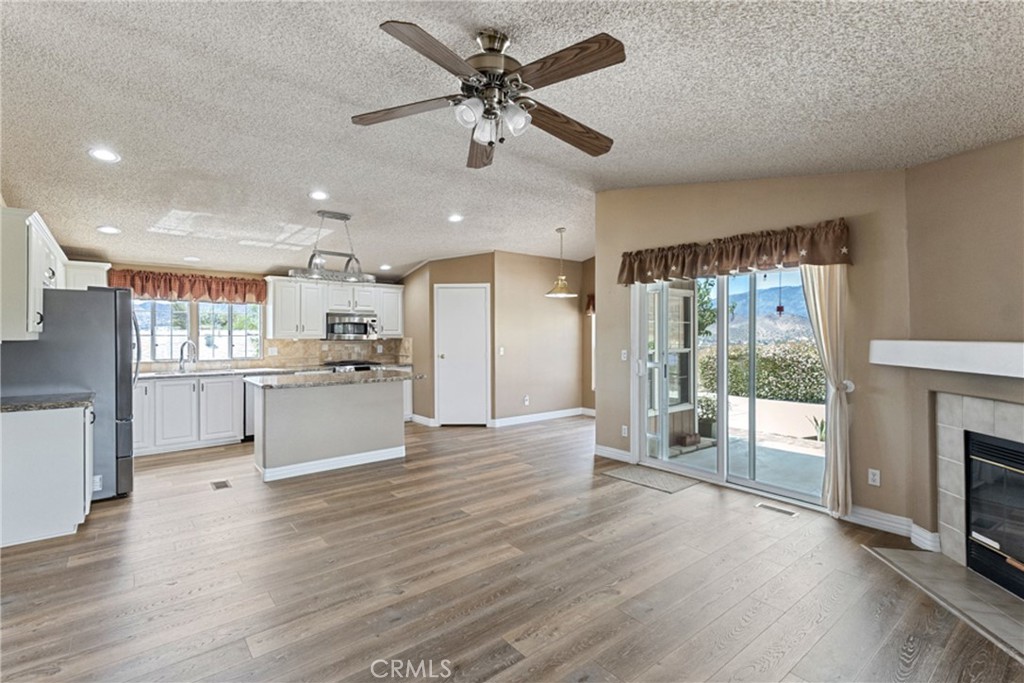 33105 Santiago Road, Unit 149 Acton, CA 93510 - Photo 10 of 28 a view of kitchen with cabinets and wooden floor