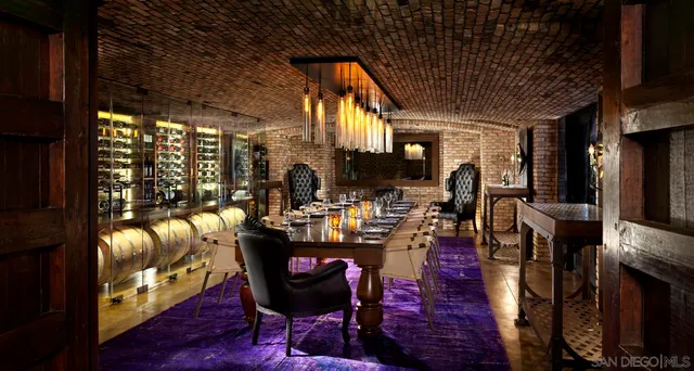 an outdoor sitting area with a table and chairs