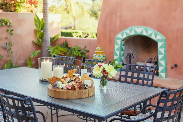 a view of a dining room with furniture and a potted plant