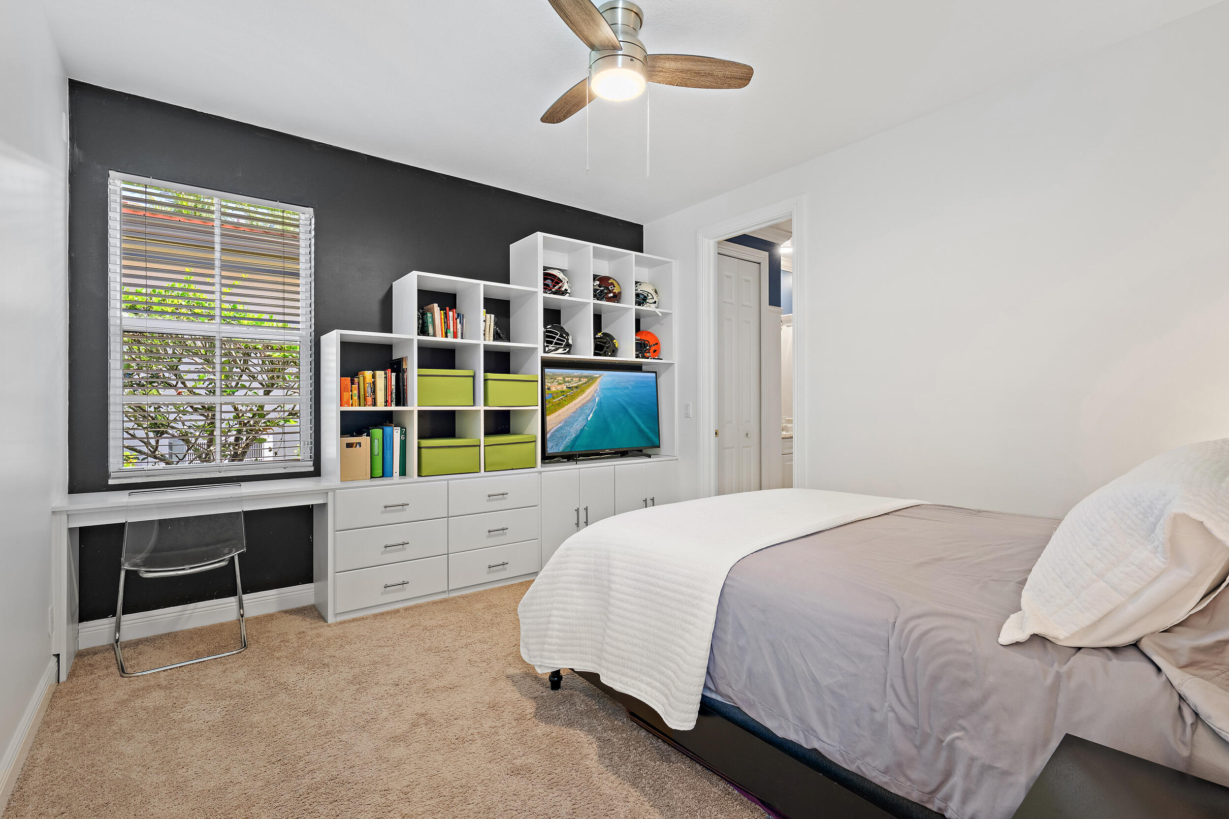 105 Segovia Way Jupiter, FL 33458 - Photo 18 of 33 a bedroom with a bed and a window