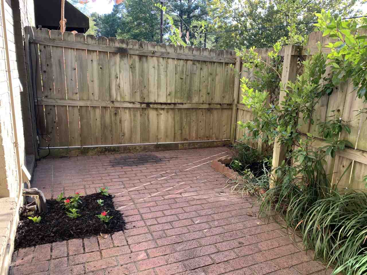 983 June Road, Unit 1 Memphis, TN 38119 - Photo 13 of 14 Private Wood-Fenced Courtyard/Patio