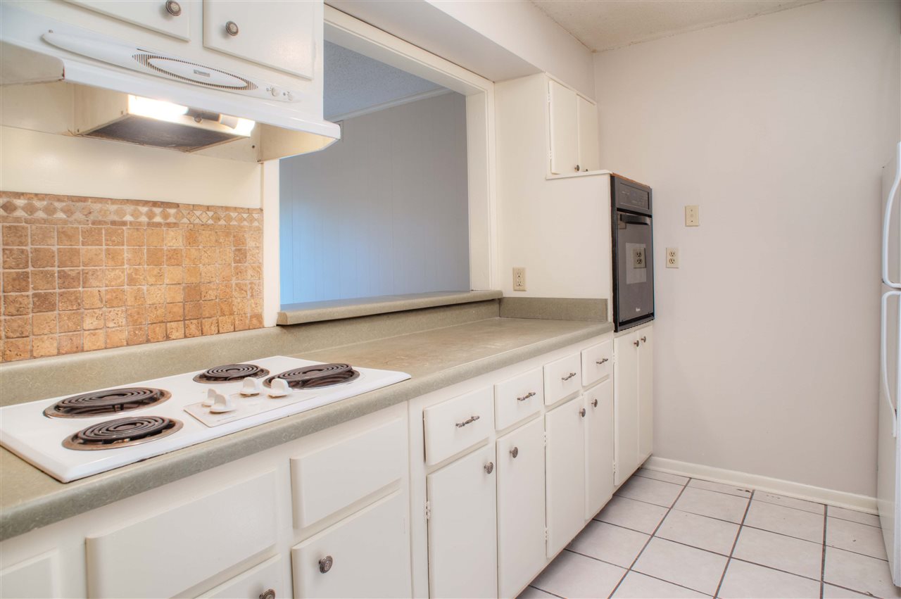 983 June Road, Unit 1 Memphis, TN 38119 - Photo 6 of 14 Kitchen with Cooktop, Range, Refrigerator, Dishwasher, Disposal, and Washer/Dryer. PLUS there are 22 Cabinets + a Large Pantry!