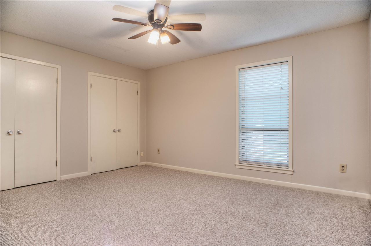 983 June Road, Unit 1 Memphis, TN 38119 - Photo 8 of 14 Master Bedroom with Two Double Closets, Ceiling Fan, Fresh Paint and New Carpet
