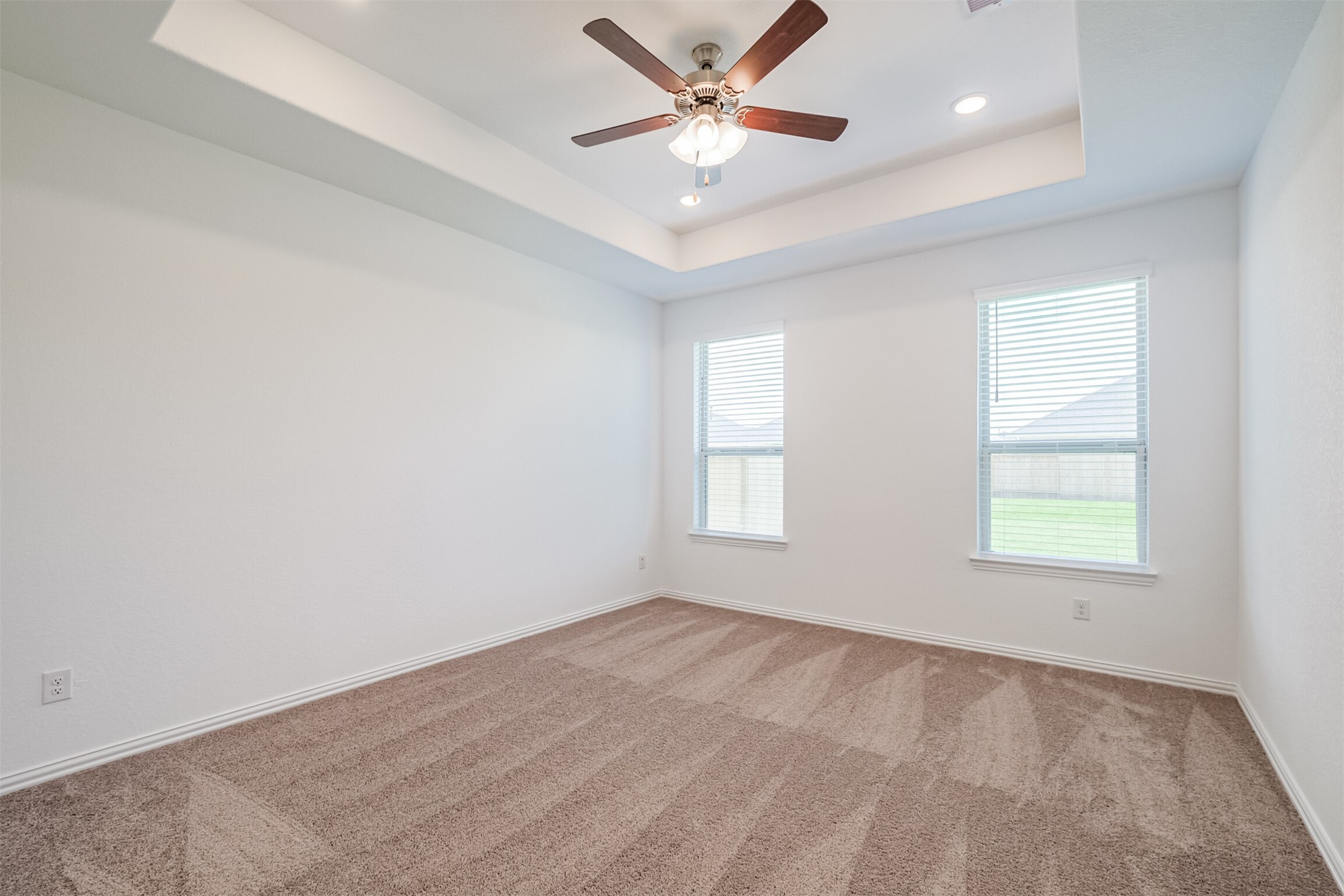 7922 Chukka Drive Fulshear, TX 77441 - Photo 21 of 39 an empty room with a window and a fan