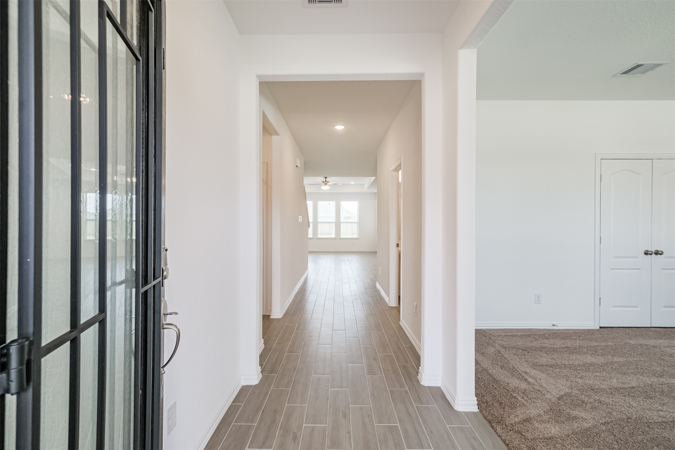 7922 Chukka Drive Fulshear, TX 77441 - Photo 23 of 39 a view of hallway with wooden floor